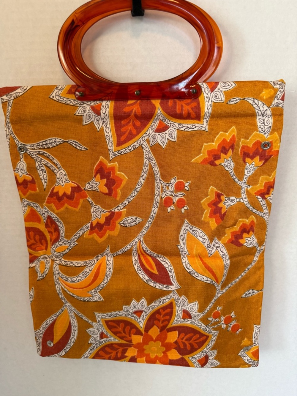 Vintage foldable tote bag with amber tortoiseshell lucite handles,